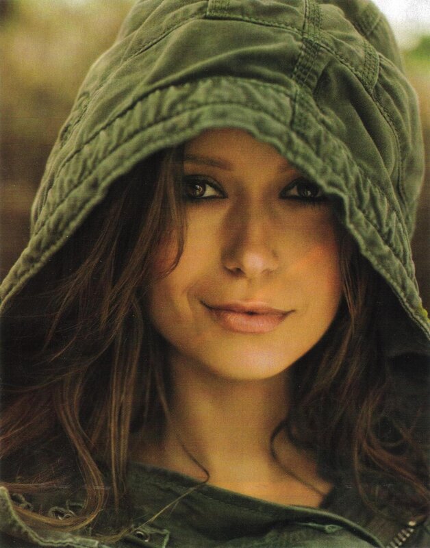 woman in green hooded jacket