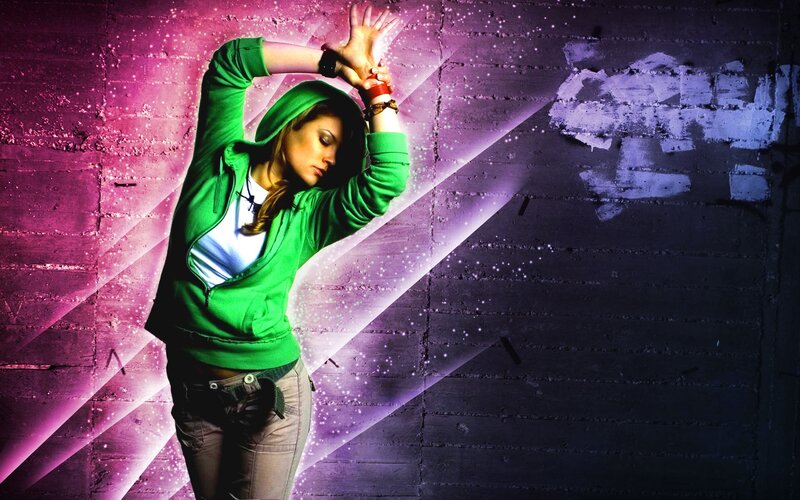 woman in green hoodie dancing