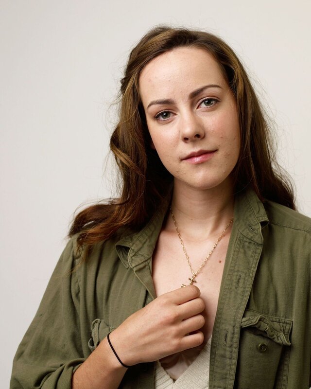 woman in green jacket