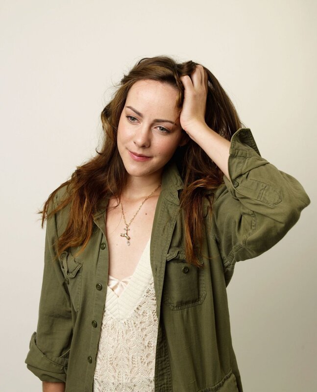 woman in green jacket