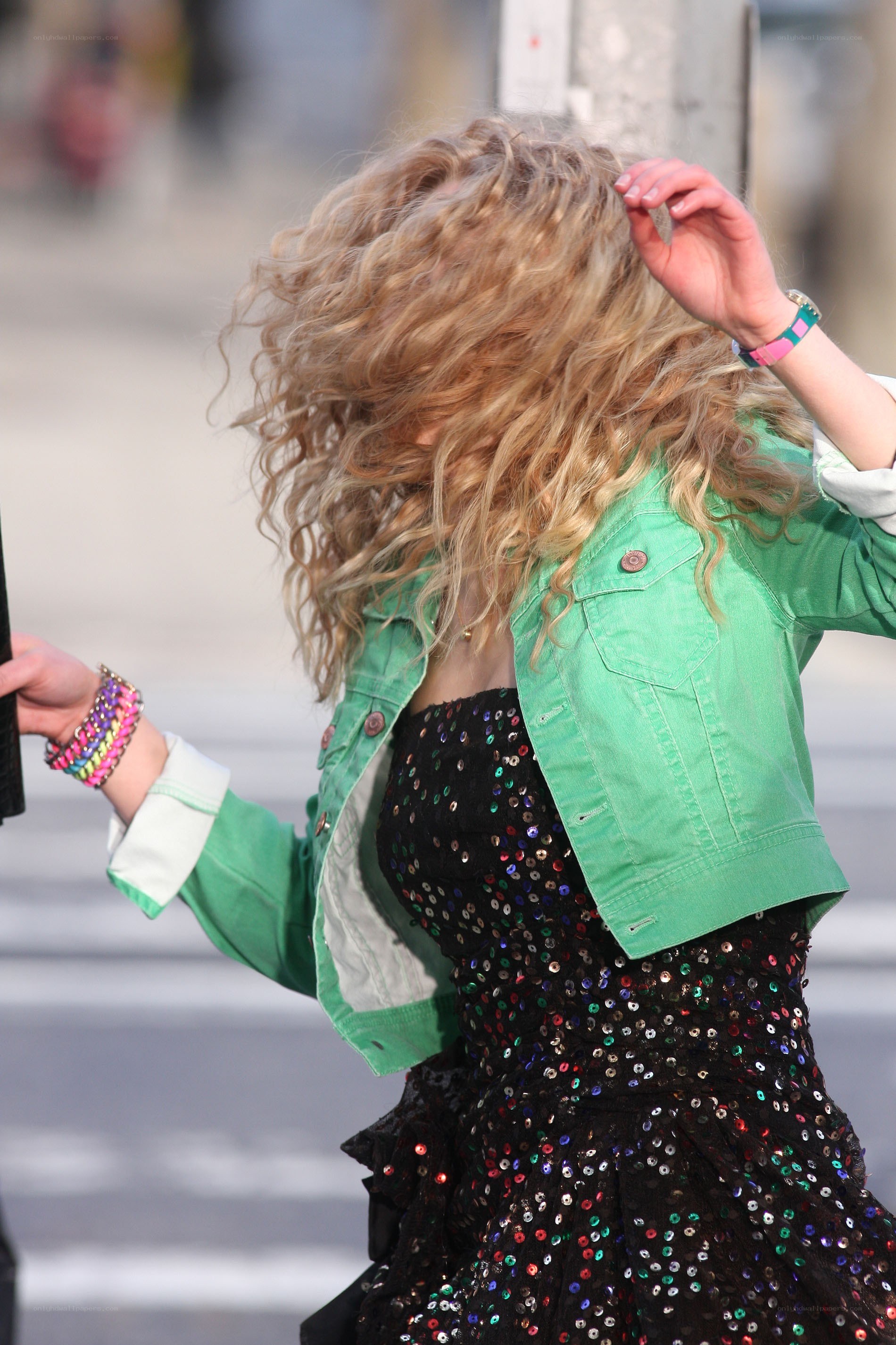 woman in green jacket and sequins