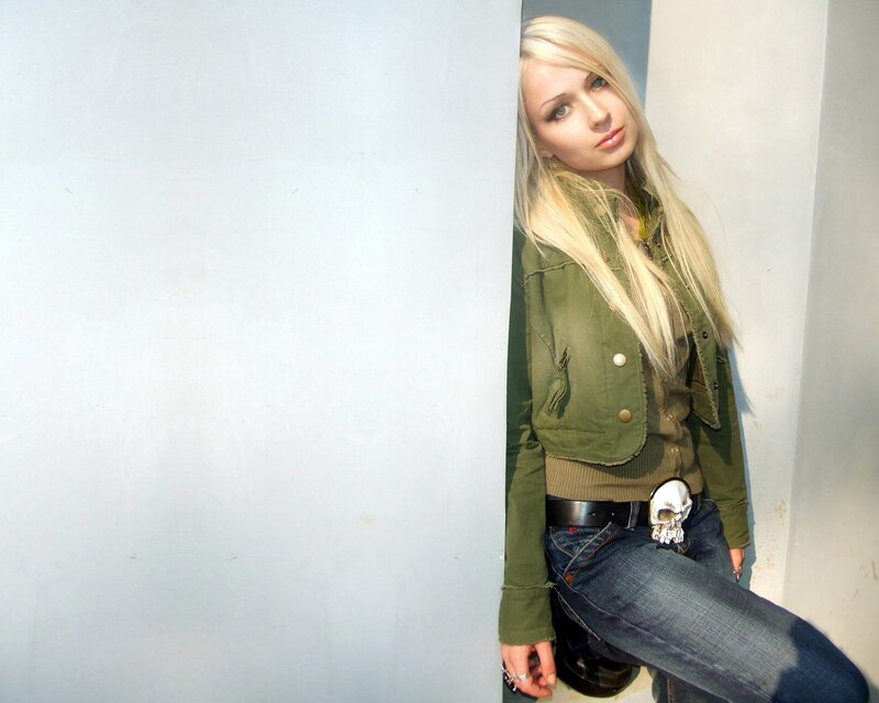 woman in green jacket leaning