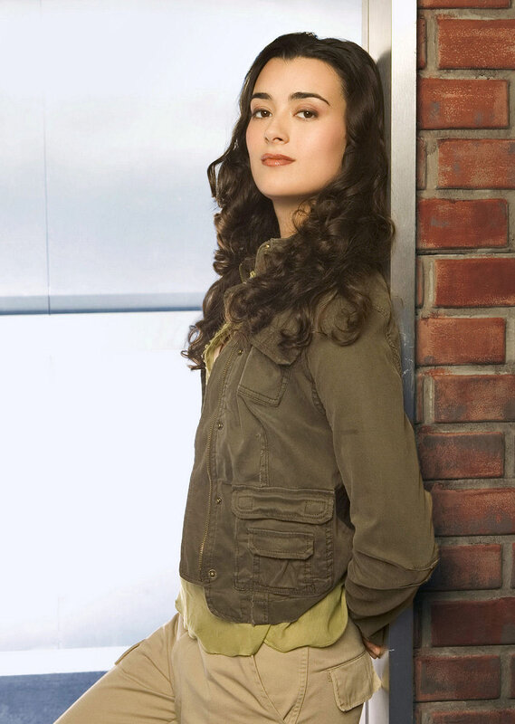 woman in green jacket leaning