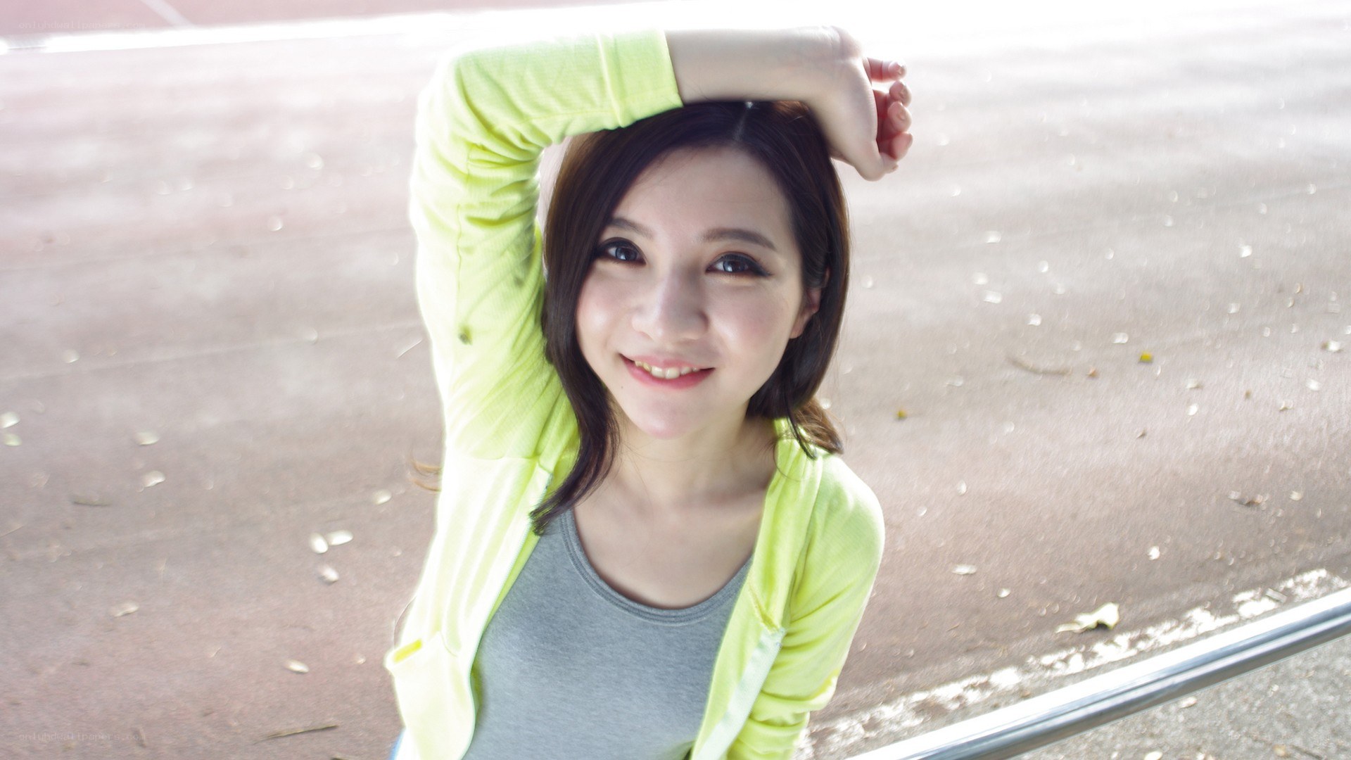 woman in green jacket smiling