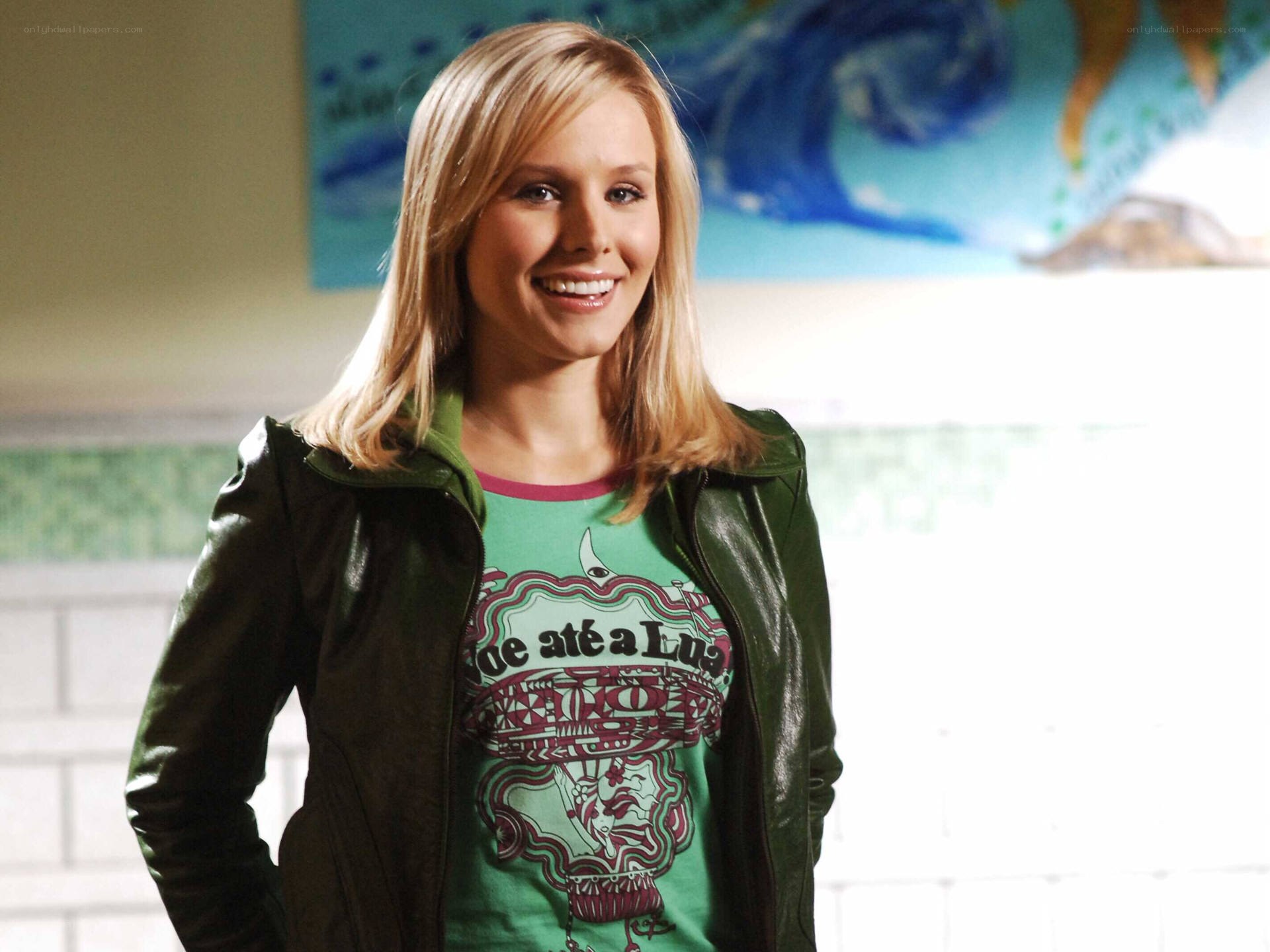 woman in green jacket smiling