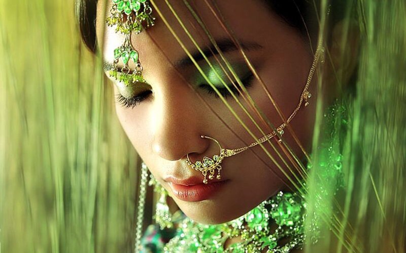 woman in green jewelry