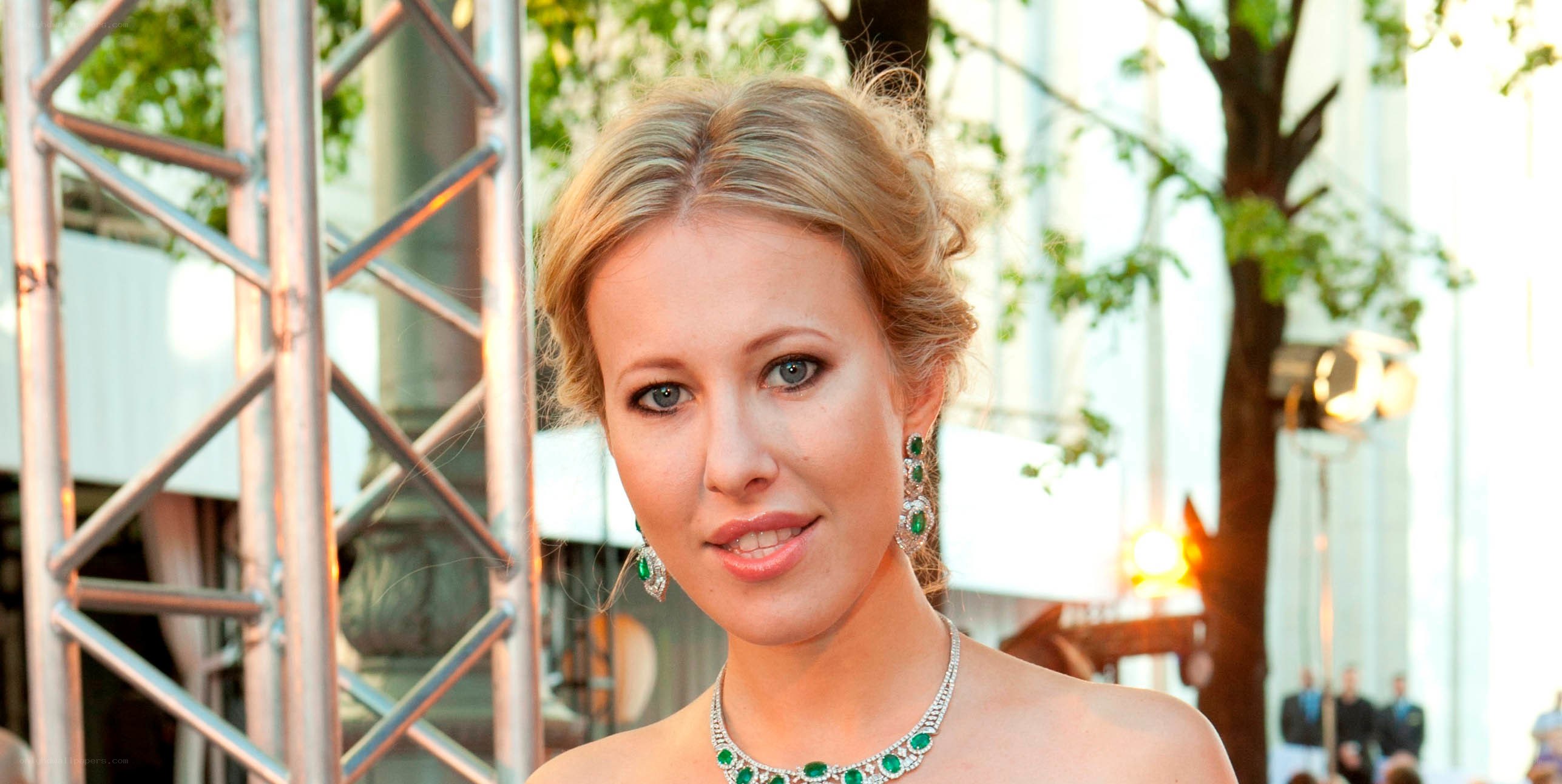 woman in green jewelry