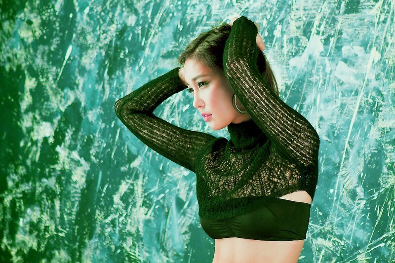 woman in green knit top
