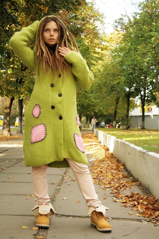 Woman in green knitted coat