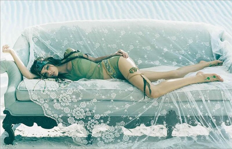 woman in green lingerie on couch