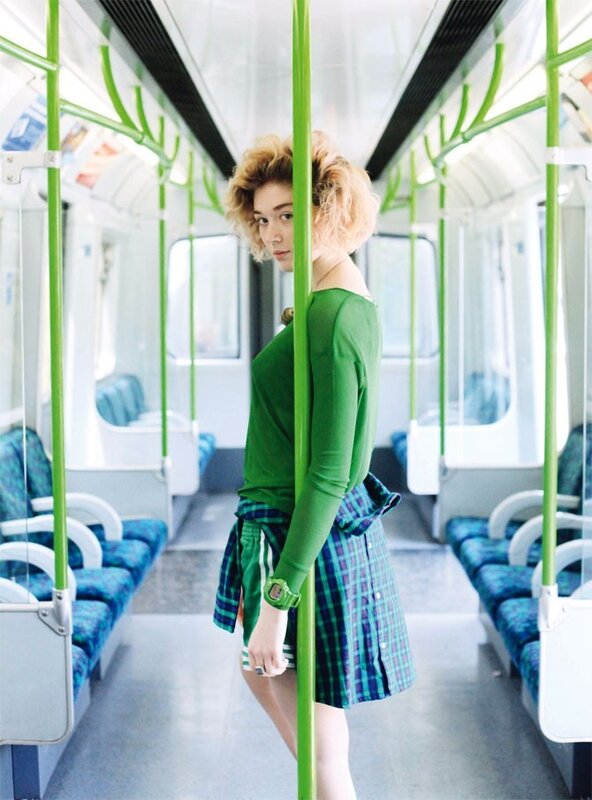 Woman in green on subway