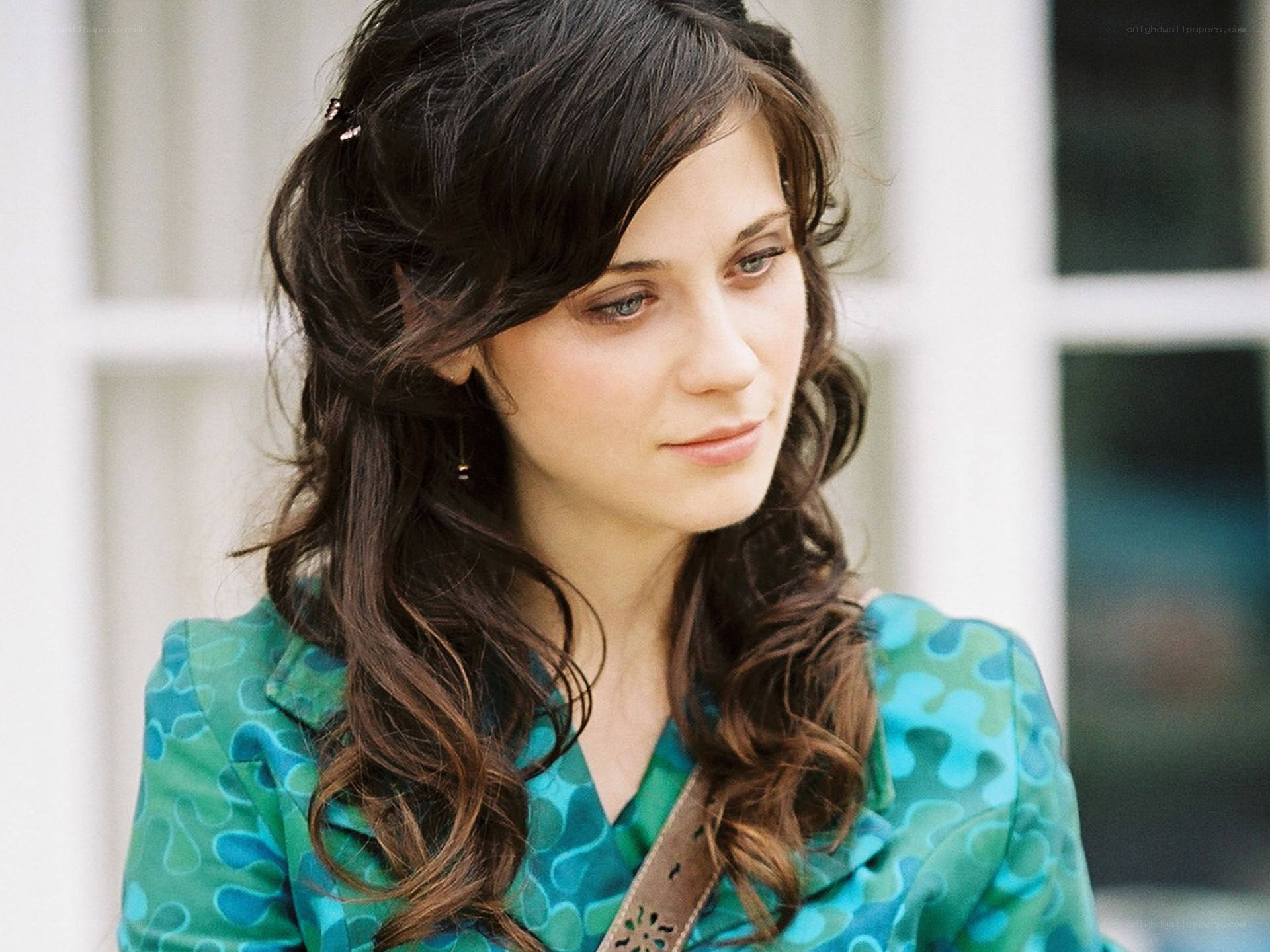 woman in green patterned blouse
