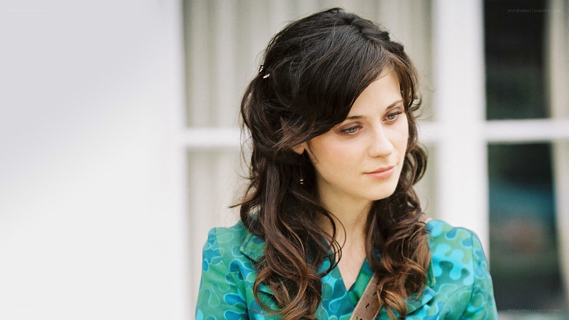 woman in green patterned top