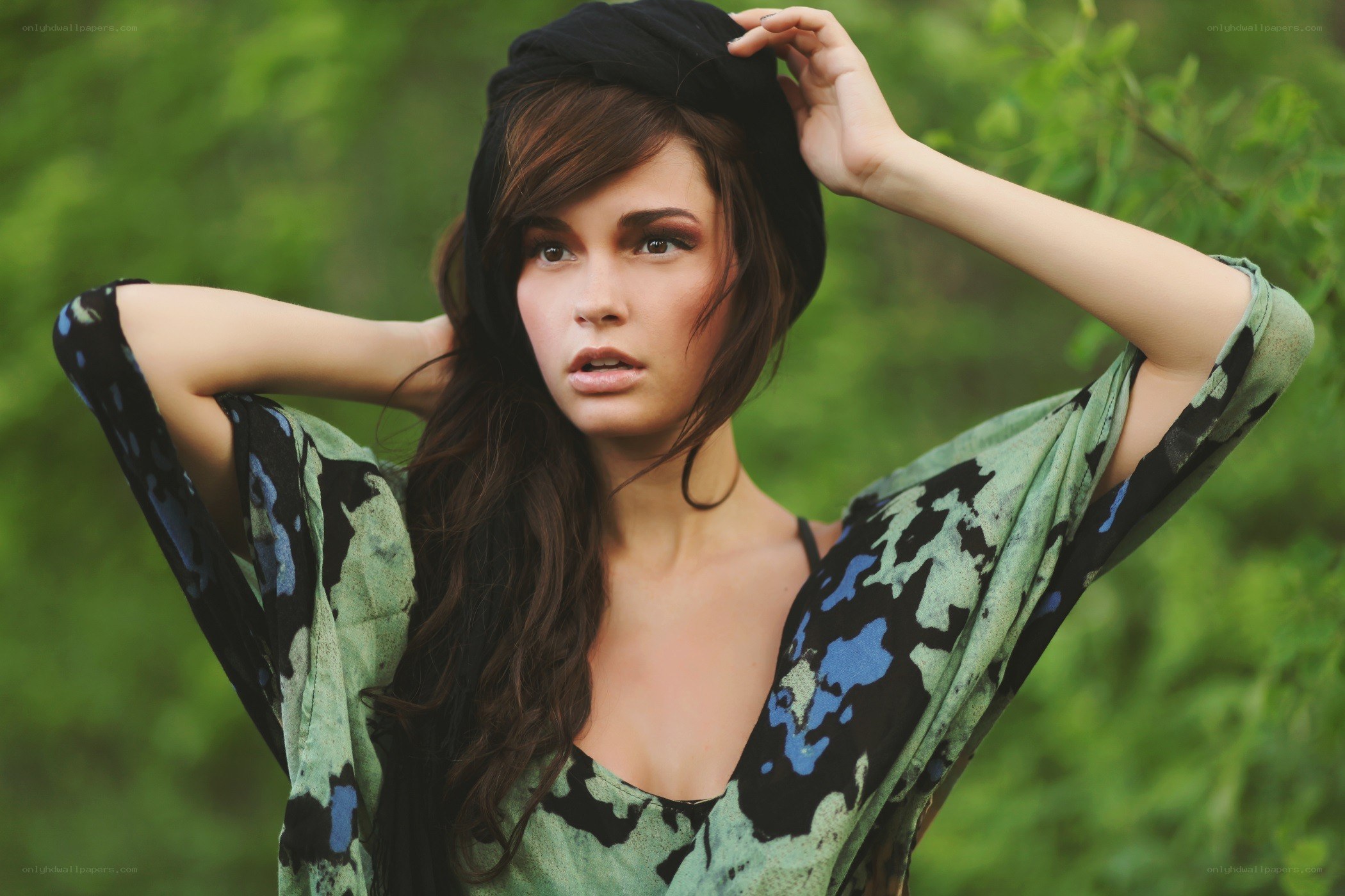 woman in green patterned top