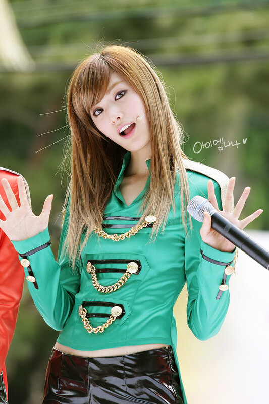 woman in green performing