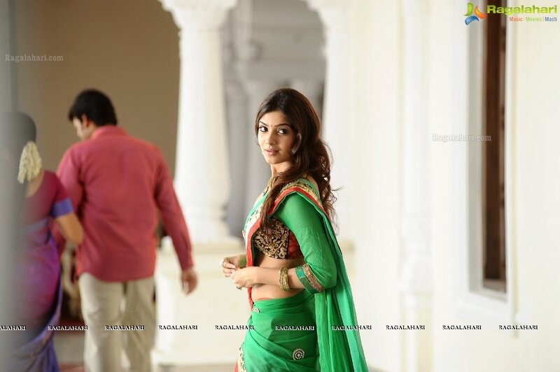 woman in green sari looking back