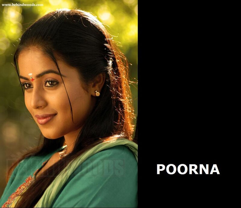 woman in green sari smiling