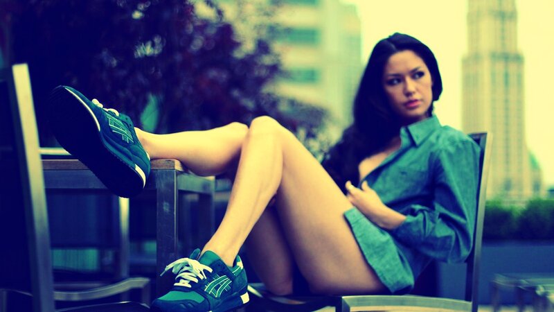 woman in green shirt and sneakers