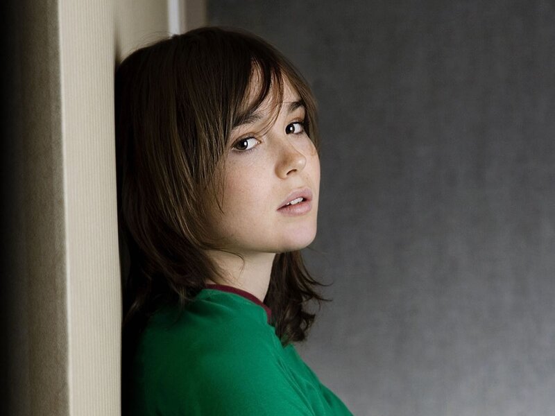 woman in green shirt leaning