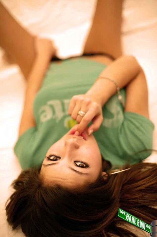 woman in green shirt lying down