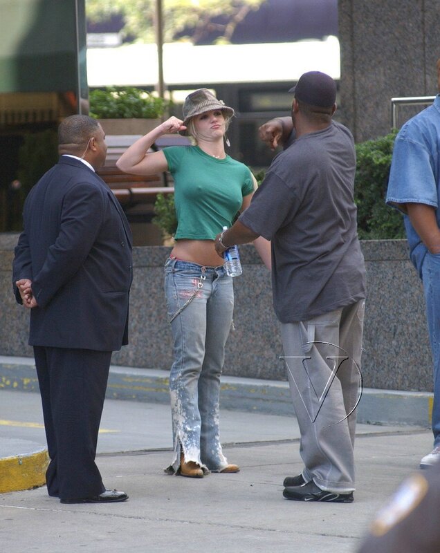 Woman in green shirt on street