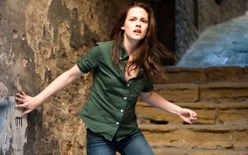woman in green shirt running