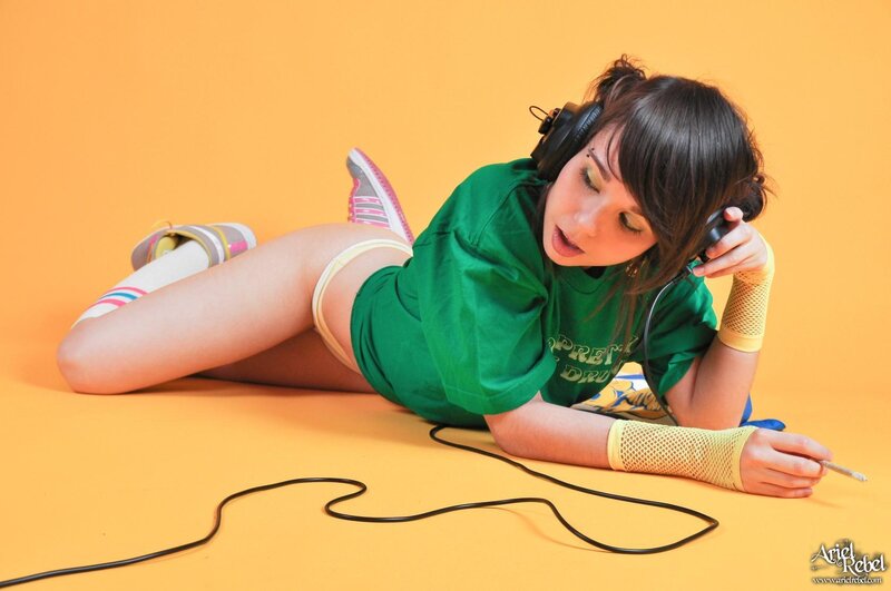 woman in green shirt with headphones