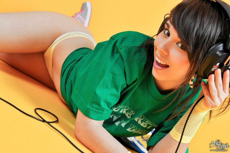 woman in green shirt with headphones