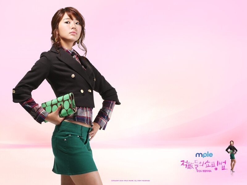 woman in green skirt posing