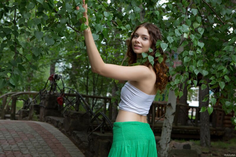 woman in green skirt under tree
