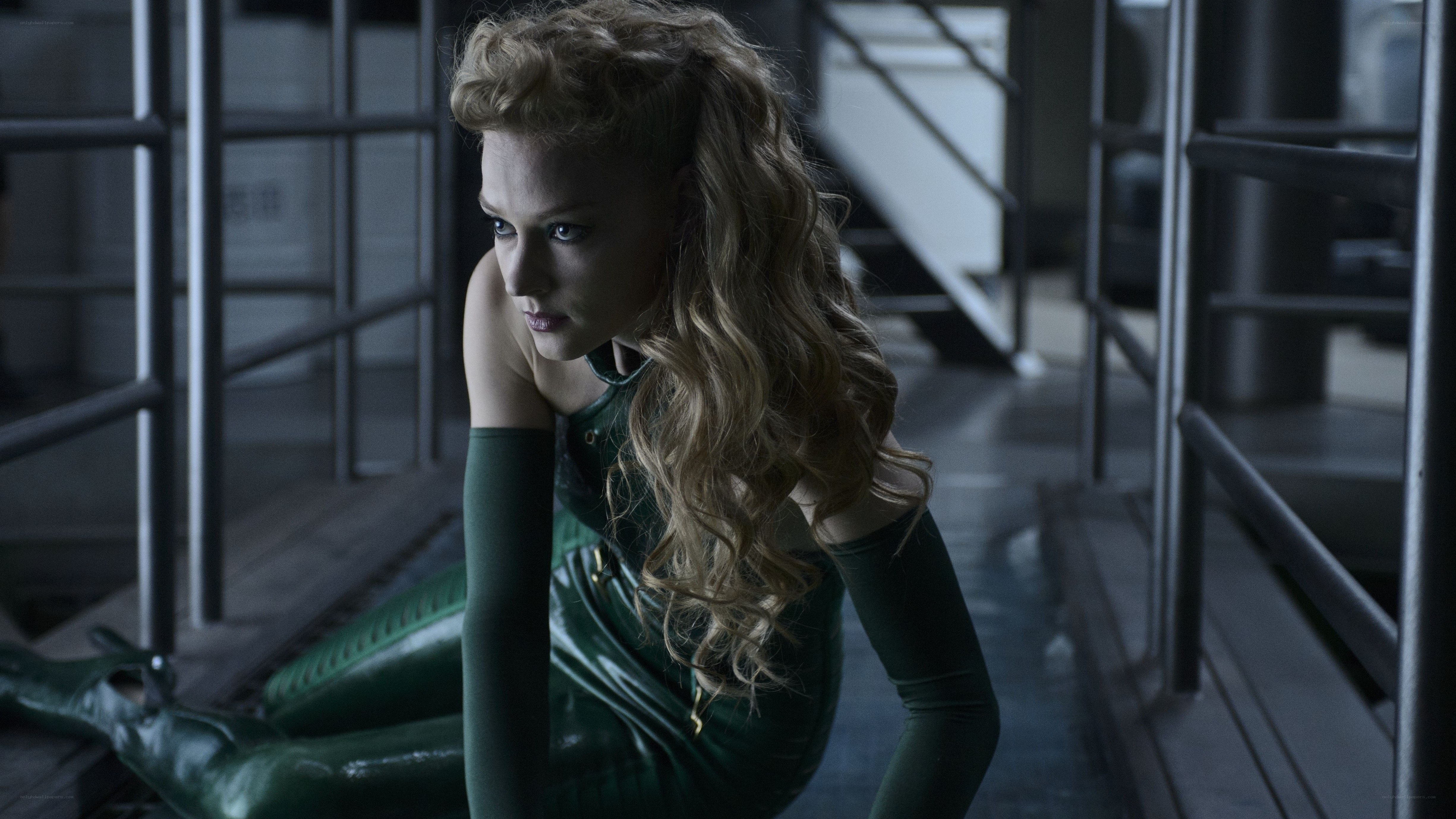 woman in green suit on platform