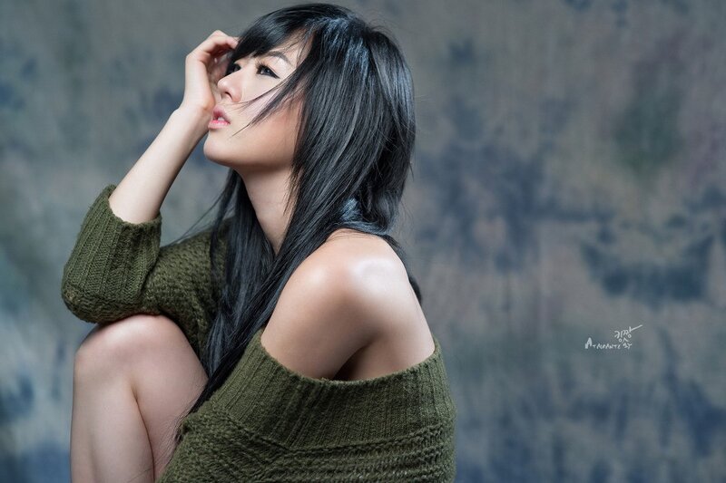 woman in green sweater