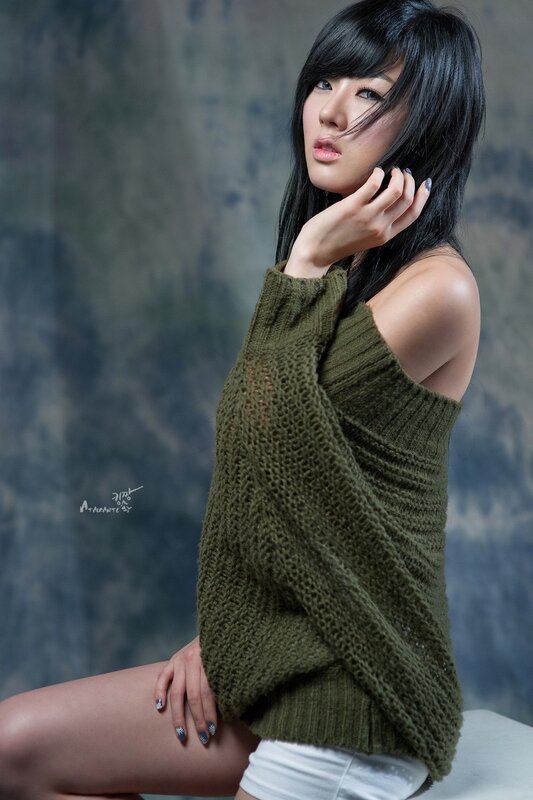 woman in green sweater