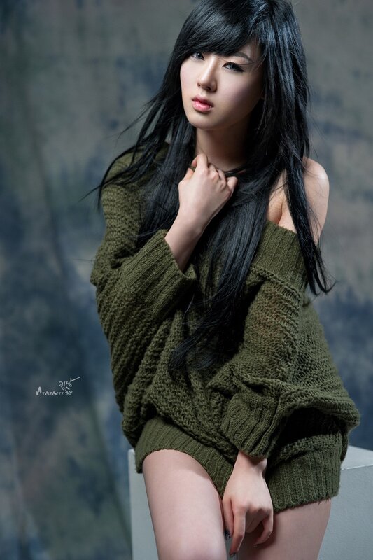 woman in green sweater