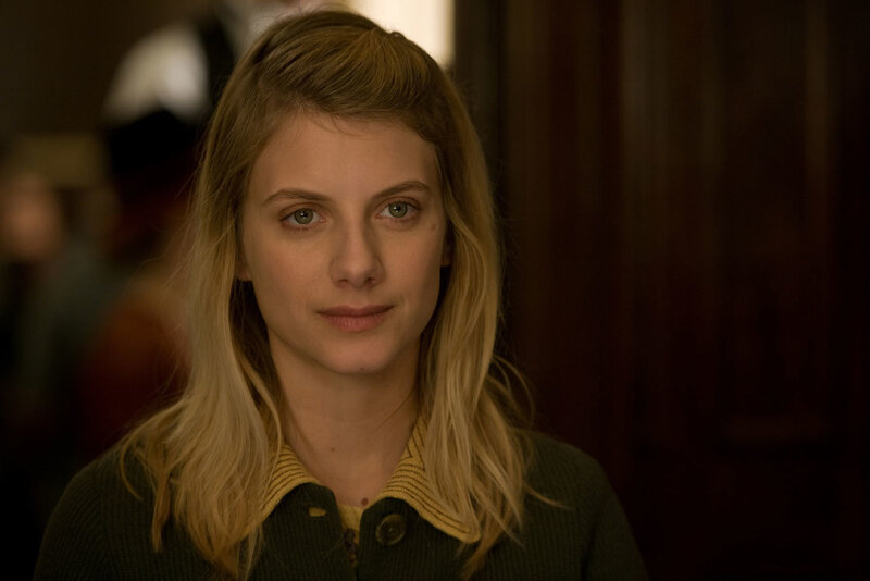 woman in green sweater