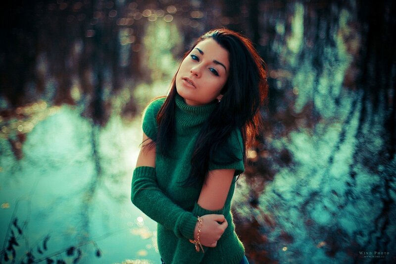 woman in green sweater outdoors