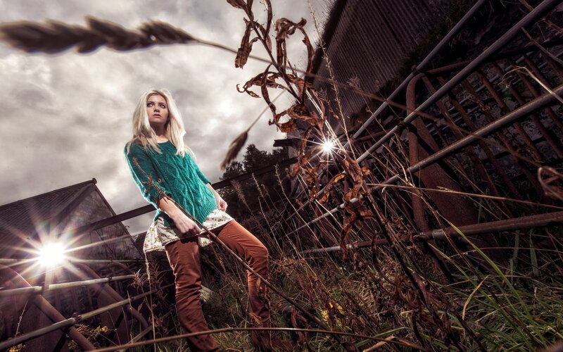 woman in green sweater standing