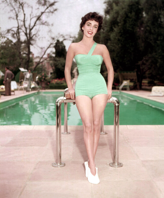 Woman in green swimsuit by pool