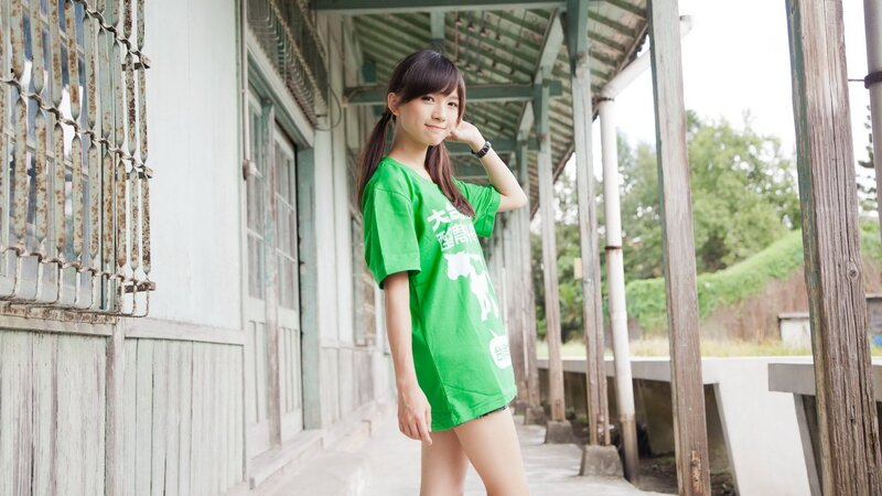 woman in green t-shirt at old station