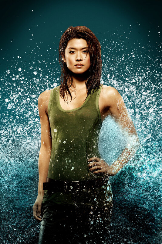 woman in green tank top with water splashing