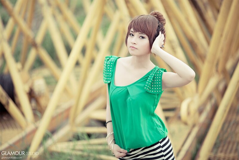 Woman in Green Top — Calm, Afternoon, Photograph, Bamboo Structure