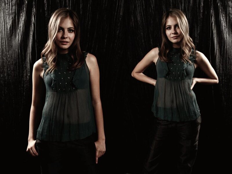 Woman in Green Top — Dramatic, Photograph, Black Background