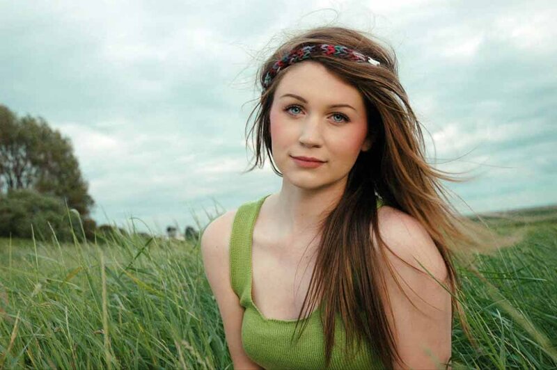 woman in green top in field