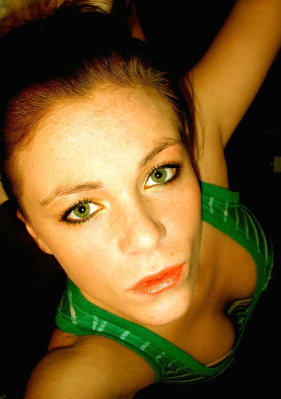 woman in green top looking up