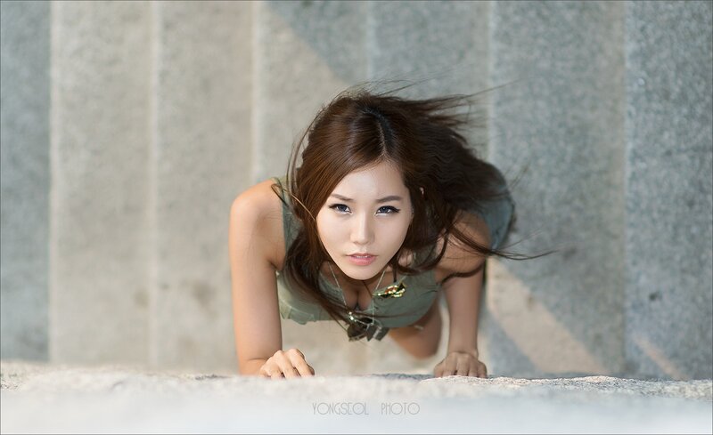 woman in green top on ground