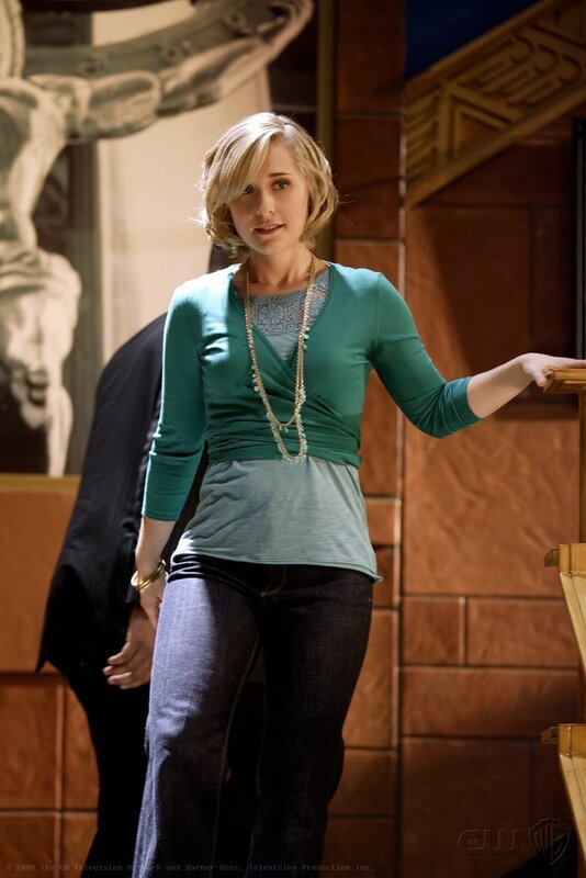 Woman in green top on set