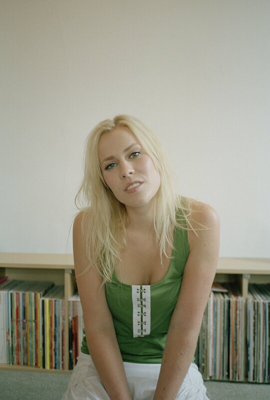Woman in green top sitting