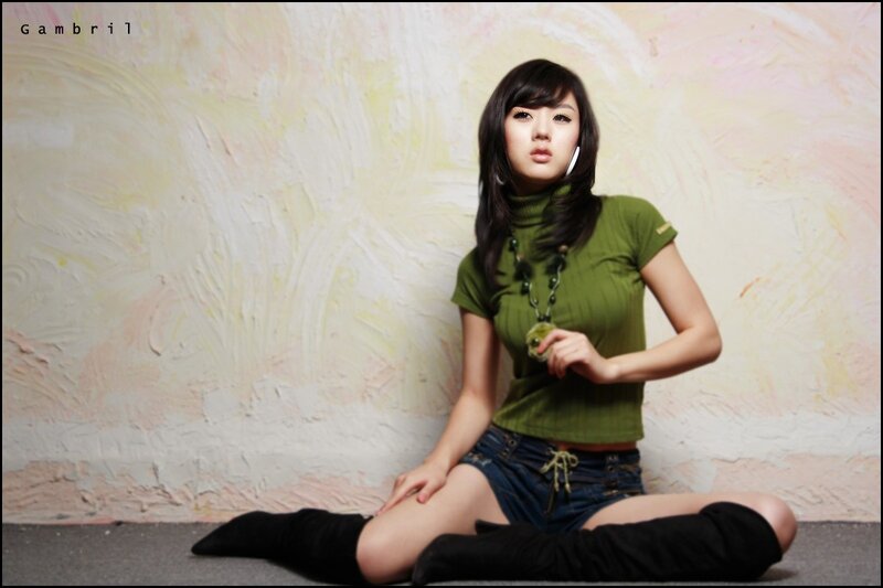 woman in green top sitting