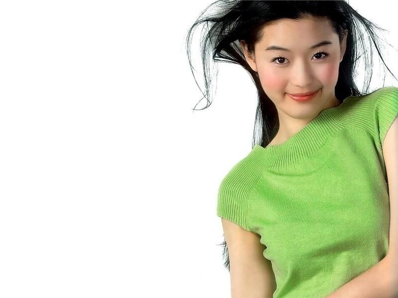 woman in green top smiling