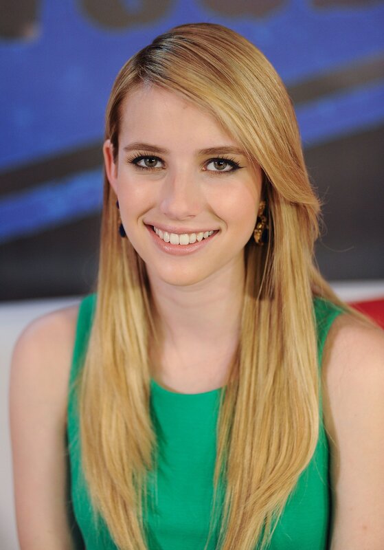 woman in green top smiling